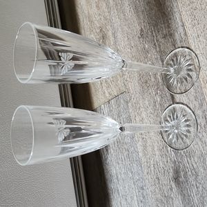 Set of champagne glasses with a craved butterfly on them